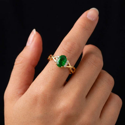 classic ring timeless ring sparkle ring bright green ring engagement ring alternative ring infinity band ring crossover band ring yellow gold ring gemstone jewelry ring