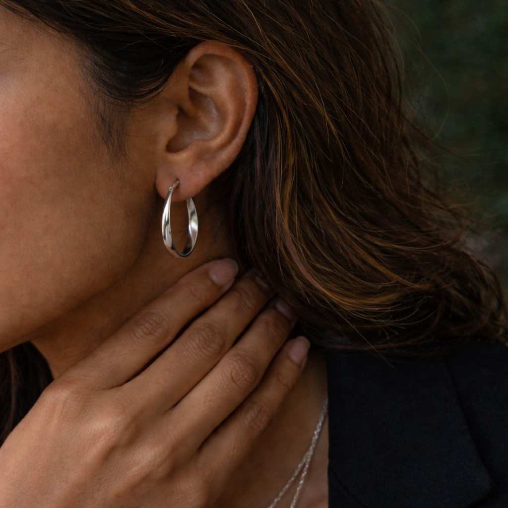 clean design earrings smooth earrings sculpted earrings geometric hoops oval earrings high polish earrings drop hoops hollow hoops medium hoops large hoops secure clasp earrings