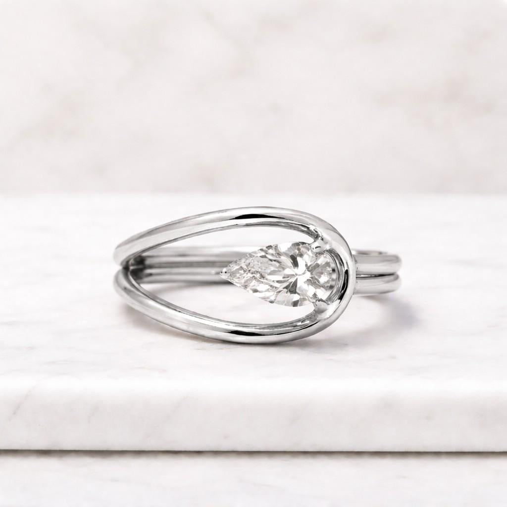 pear cut moissanite bypass ring | east west teardrop solitaire in 14k gold | unique asymmetrical engagement ring for her
