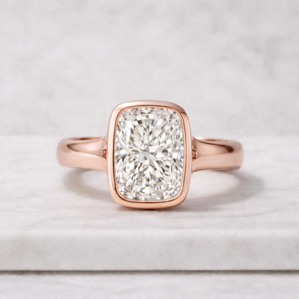 elongated cushion cut lab grown diamond ring bezel set yellow gold engagement ring modern minimalist solitaire diamond ring for women everyday wear usa high clarity diamond ring gift for her