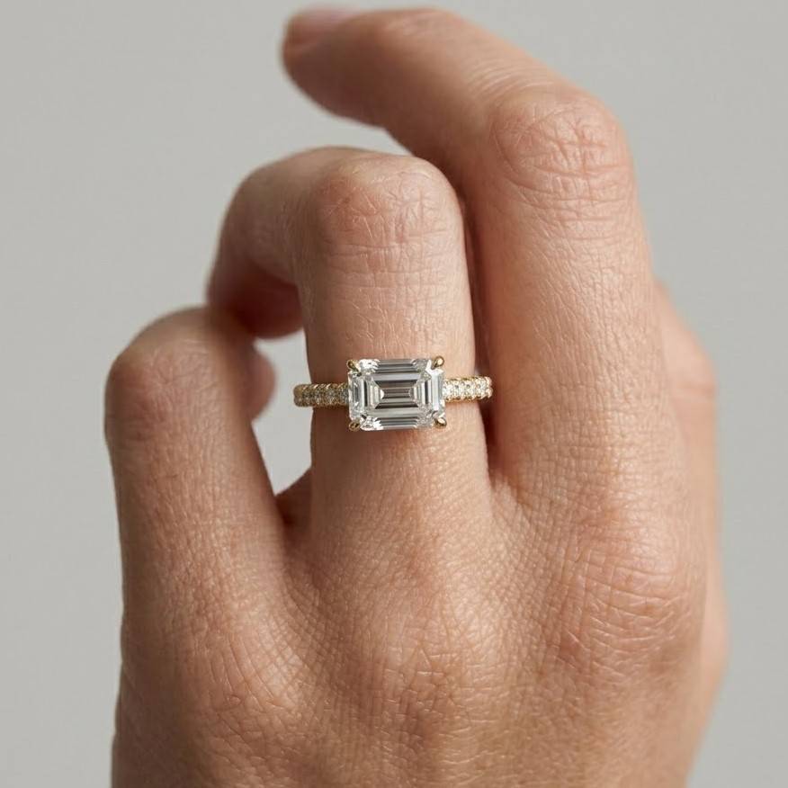 emerald cut moissanite ring: 14k gold east west statement ring