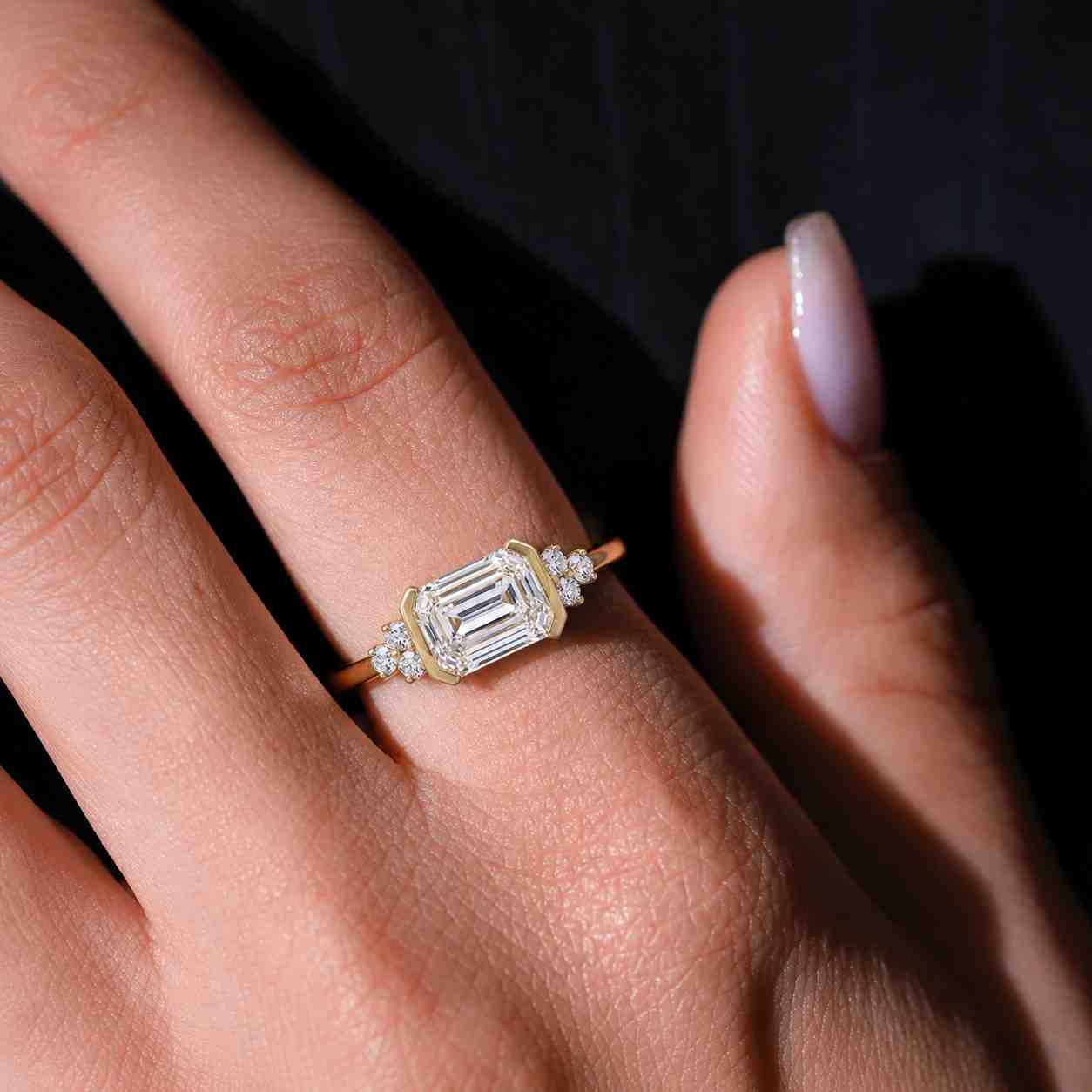 emerald shape ring rectangular diamond ring emerald bezel ring emerald solitaire ring east west ring north south ring elongated emerald ring step cut diamond hall of mirrors ring clean cut ring sharp corners ring faceted ring