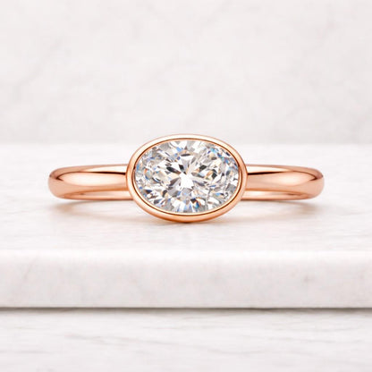 engagement ring oval solitaire thin ring smooth band comfort fit bright stone shiny ring clean style timeless ring