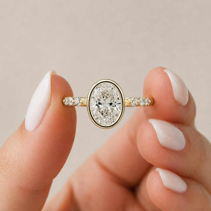 everyday ring gift ring anniversary ring wedding ring bridal jewelry fashion ring timeless ring refined ring minimalist ring delicate ring comfort fit secure setting bezel solitaire oval bezel oval engagement ring