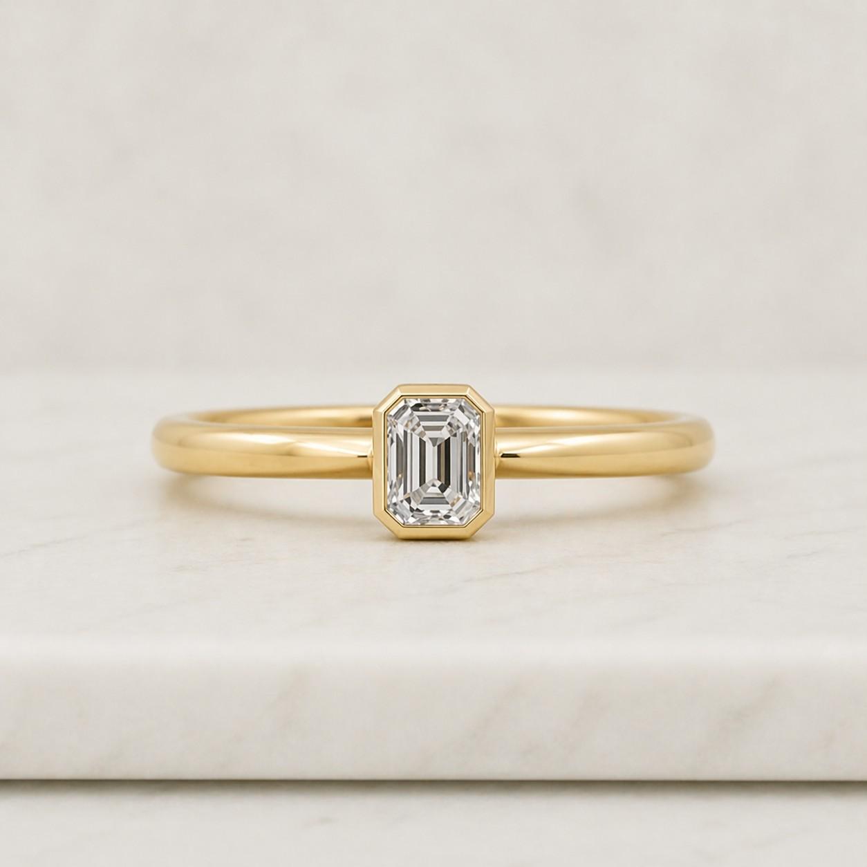 1.50 ctw emerald cut bezel set lab grown diamond engagement ring in 14k and 18k gold, modern engagement ring, genevieve
