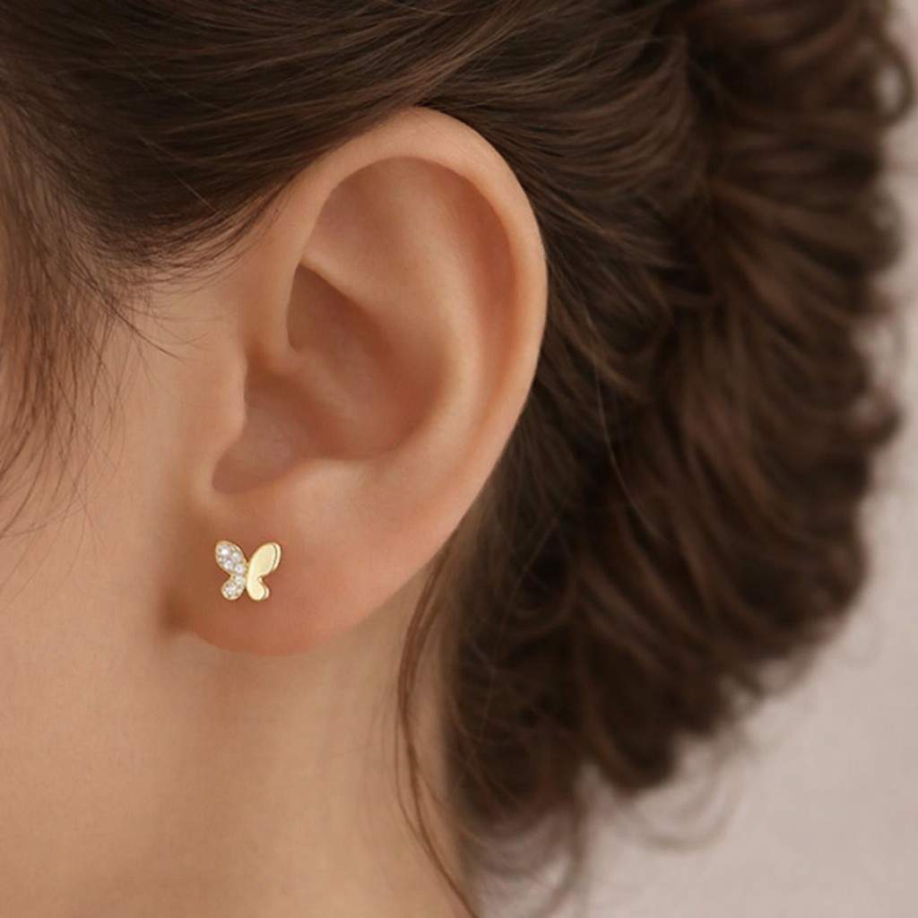 gold butterfly stud earrings with lab grown diamonds close up detail minimalist diamond earrings for women everyday wear dainty gold jewelry butterfly shape fine jewelry gift idea for her birthday