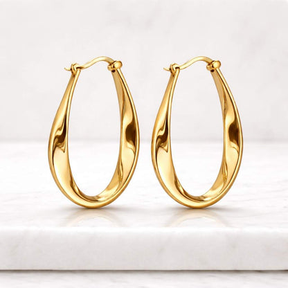 gold hoop earrings chunky hoop earrings oval hoop earrings thick hoop earrings statement earrings bold hoop earrings polished earrings shiny gold earrings modern hoop earrings