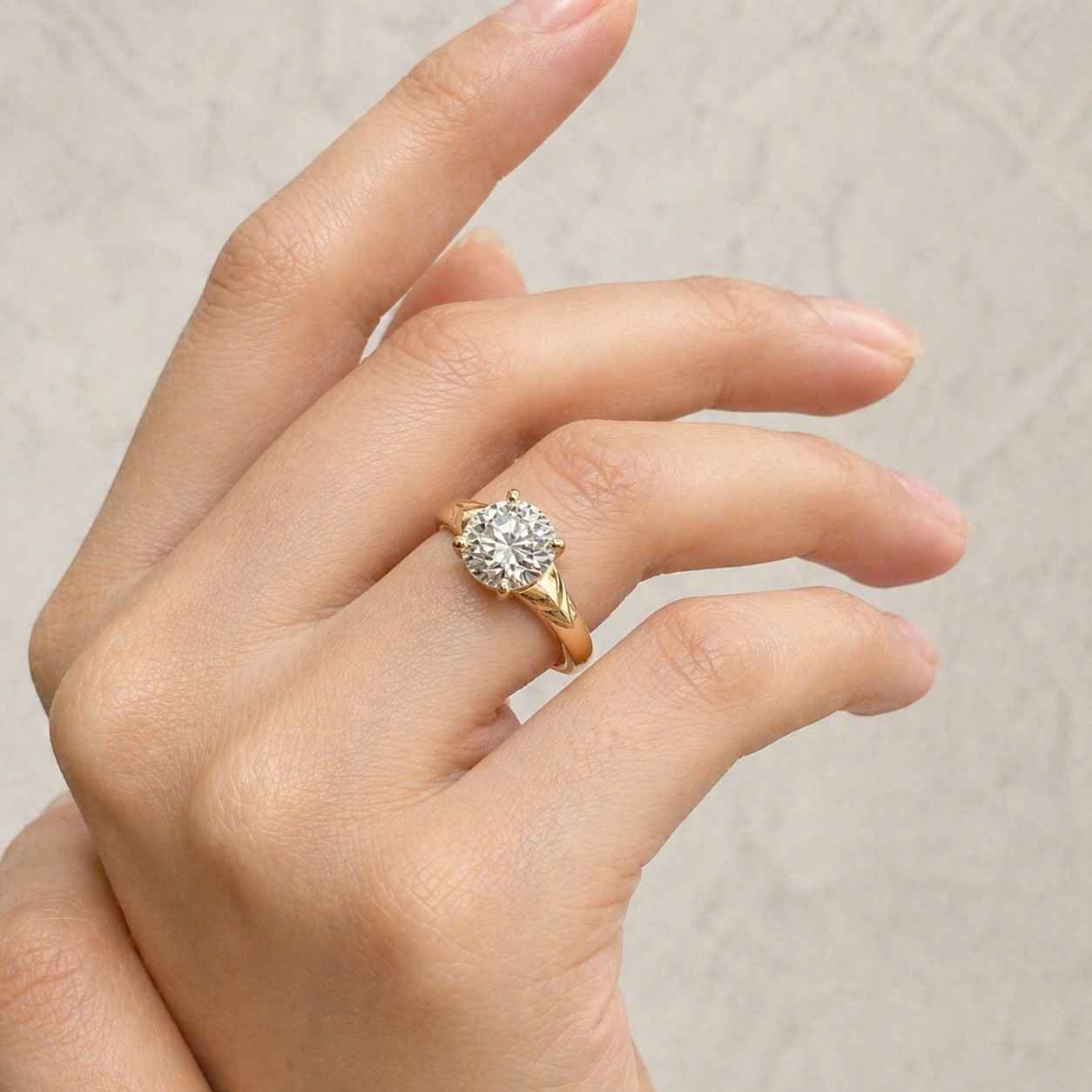 engagement ring with a 2-carat round solitaire in a prong setting, flat band and "cathedral high" setting
