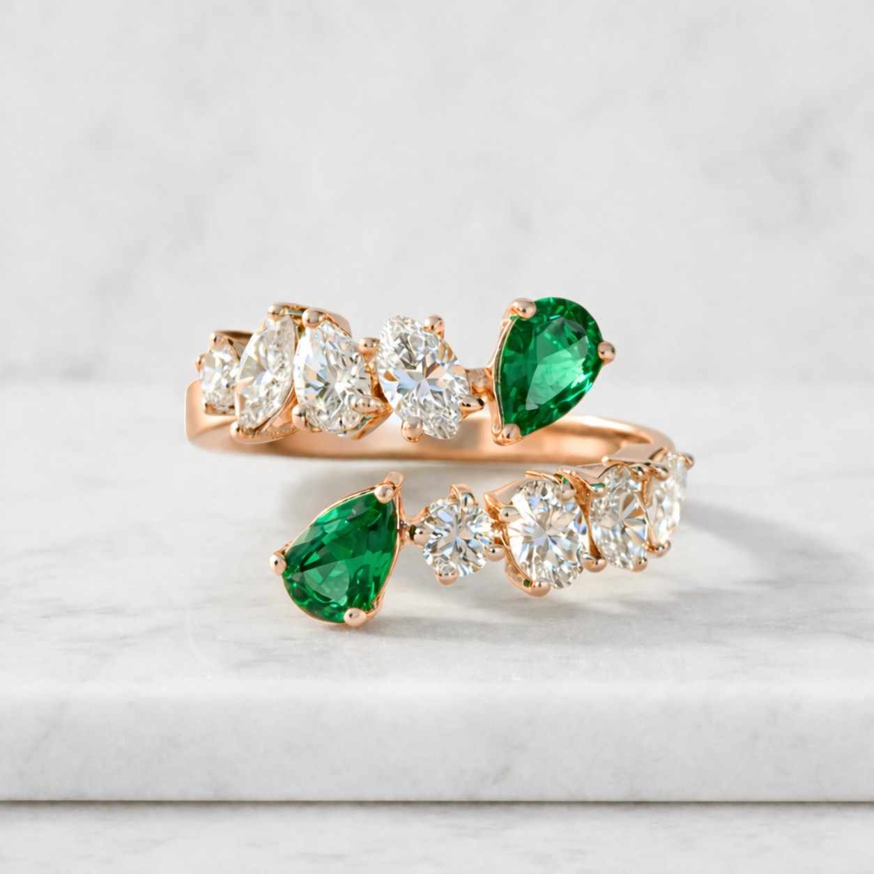 handmade 18k white gold emerald and diamond bypass ring
