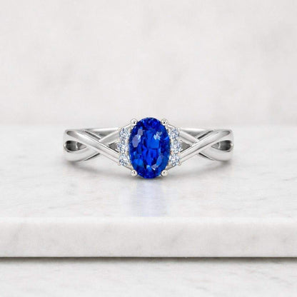 oval cut ring blue gemstone ring sapphire jewelry gold jewelry twisted ring crossover band criss cross ring infinity band ring knot style ring modern ring vintage style ring heirloom ring bridal jewelry wedding ring