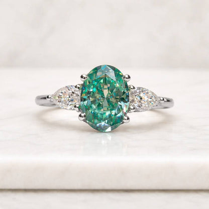 oval engagement ring three stone ring green gemstone ring teal stone ring oval cut ring marquise side stones white metal ring solitaire style ring statement ring women ring
