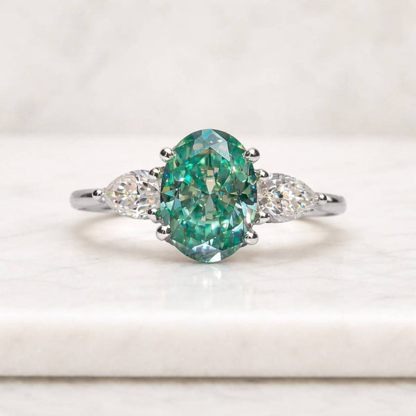 oval engagement ring three stone ring green gemstone ring teal stone ring oval cut ring marquise side stones white metal ring solitaire style ring statement ring women ring