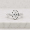Oval Cut Lab Grown Diamond Bezel Engagement Ring With Pave Set