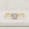 Oval Cut Lab Grown Diamond Bezel Engagement Ring in 14K Yellow Gold