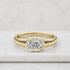Oval Cut Lab Grown Diamond Bezel Set Engagement Ring in Yellow Gold