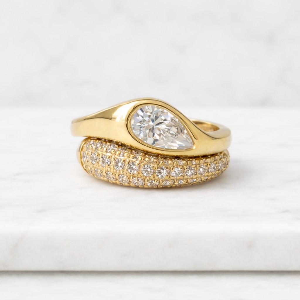 1.25 carat pear cut moissanite bezel set ring | 14k rose gold tapered solitaire | unique modern tear drop engagement ring for women
