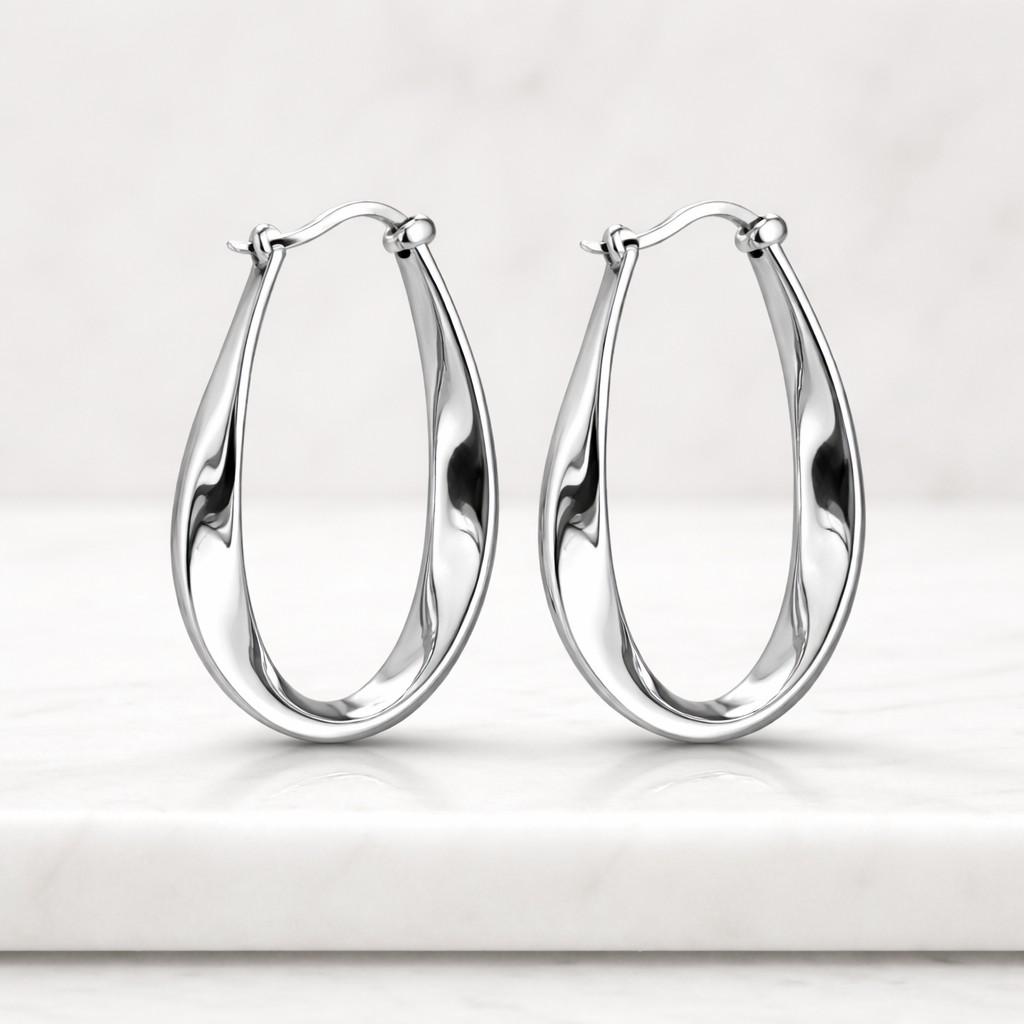 refined earrings timeless hoops classy earrings upscale earrings oval jewelry sleek gold earrings high shine hoops chic gold hoops artistic earrings modern gold jewelry