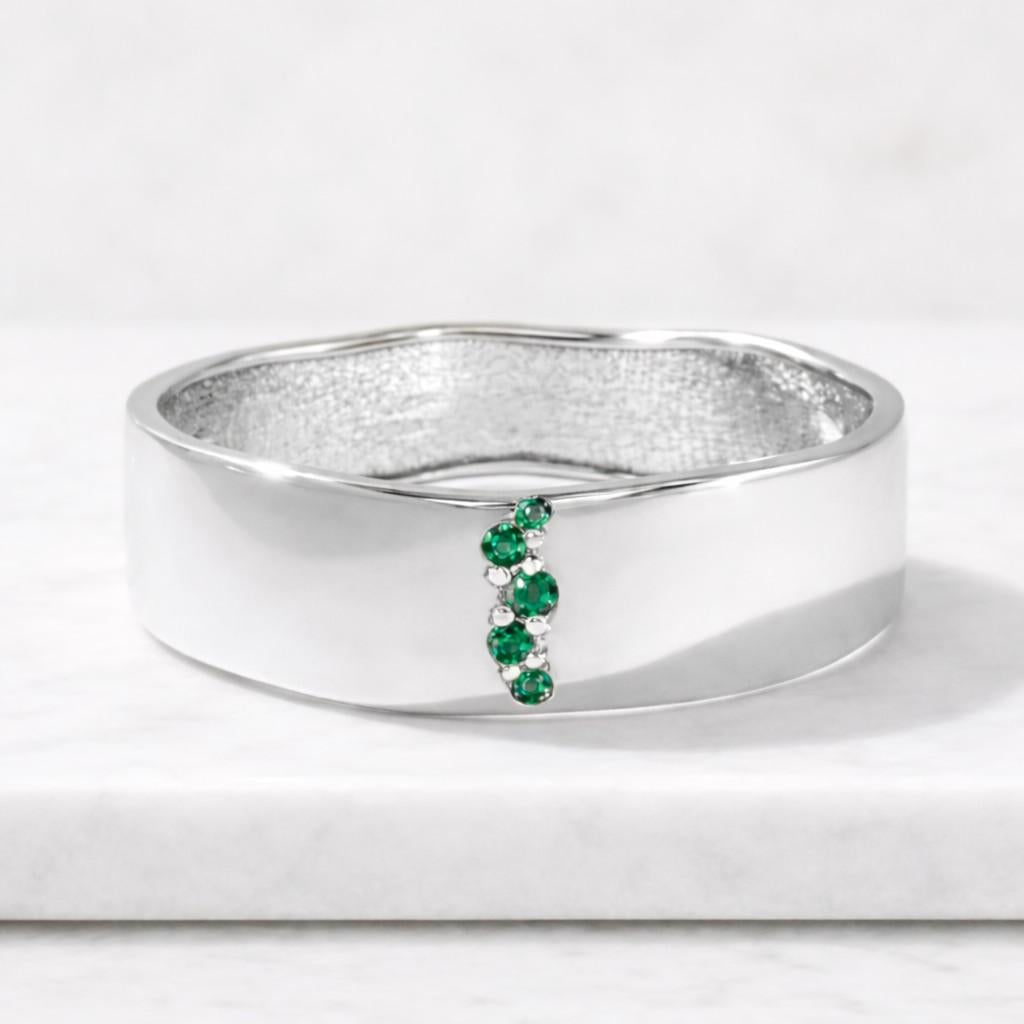 emerald diamond cluster ring | two-tone gold geometric statement band