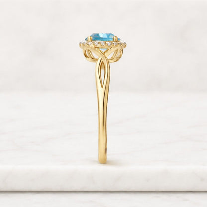 round aquamarine ring halo engagement ring infinity band ring open twist ring blue stone ring yellow gold ring gemstone halo ring diamond halo ring bridal jewelry ring
