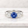 Round Cut Blue Sapphire Three Stone Engagement Ring in White Metal