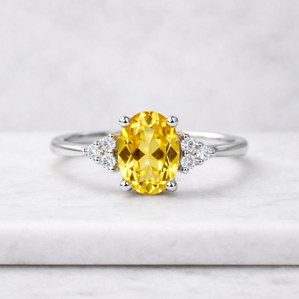 yellow oval diamond ring, three stone engagement ring with trillion side stones, anniversary gift