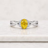 Oval Cut Yellow Sapphire Gemstone And Diamond Twist Ring